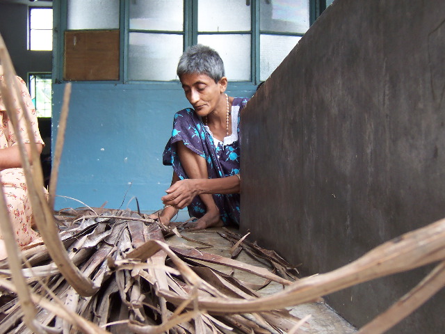 Sita, making a broom